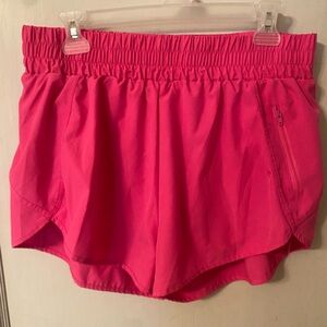 Neon pink athletic shorts